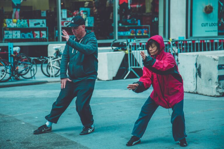 photo a man and woman doing martial arts