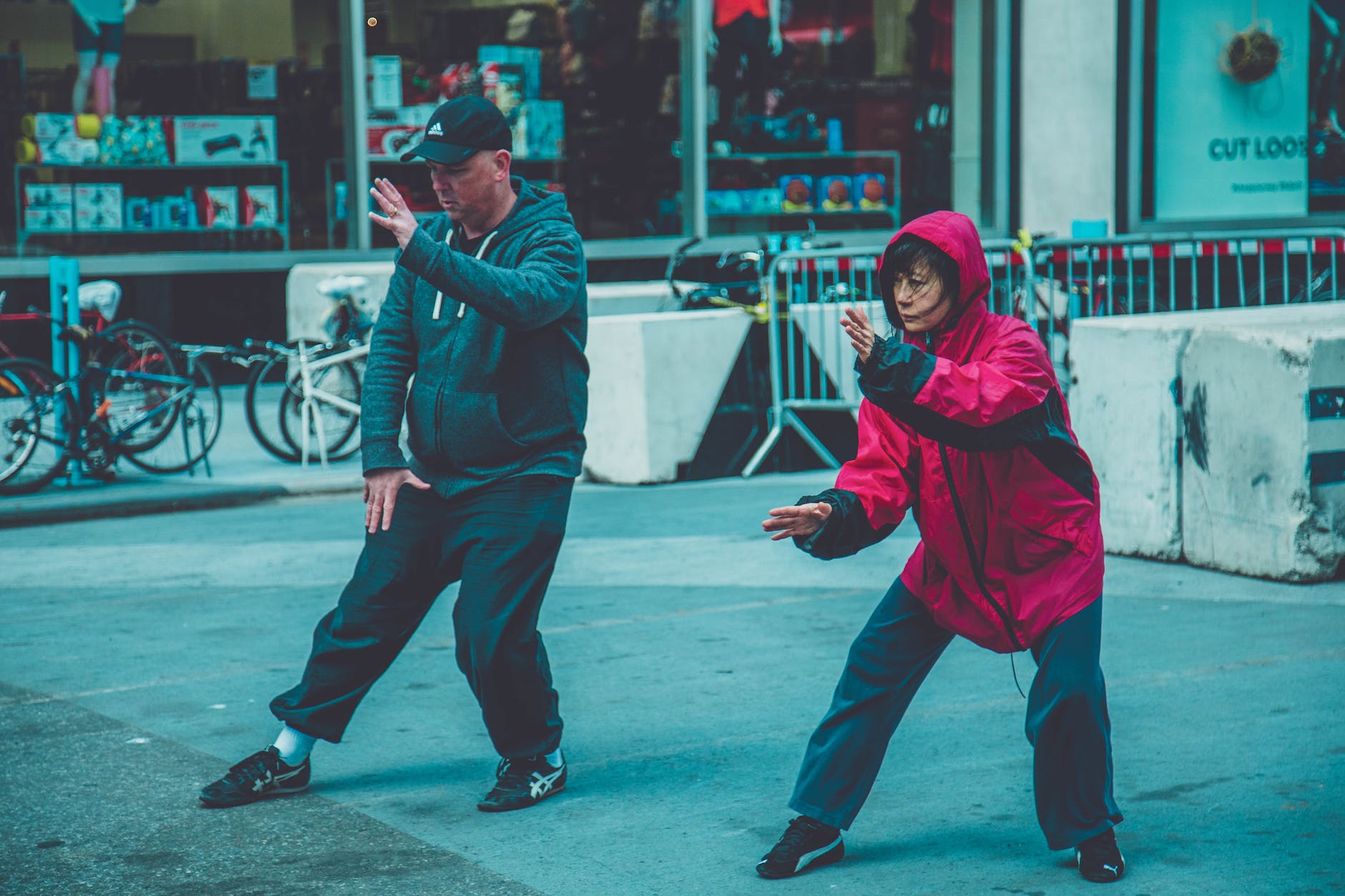 photo a man and woman doing martial arts
