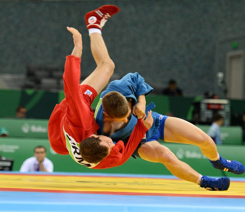 Samo athlete taking the opponent down during competition