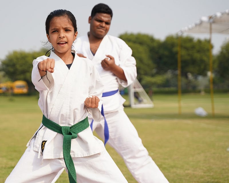 Young karate student doing katas