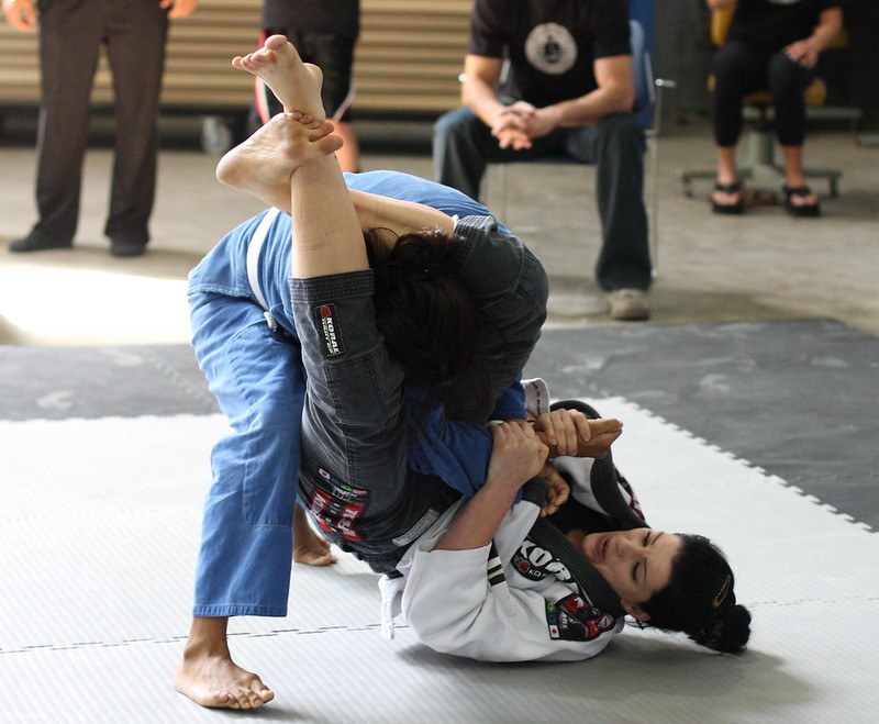 BJJ student securing a triangle choke